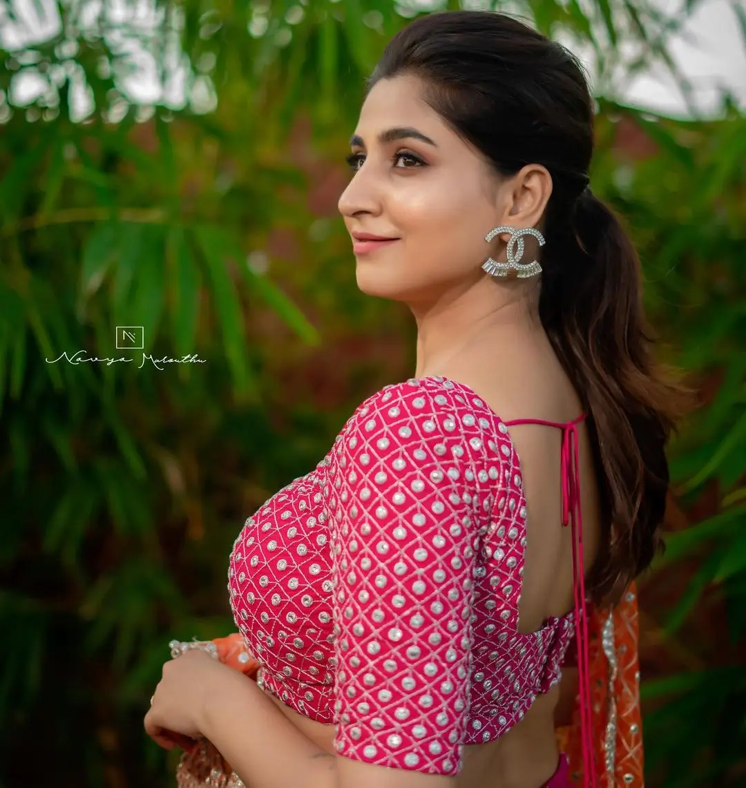 Varshini Sounderajan Wearing Orange Lehenga Choli